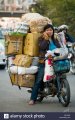 overloaded-motorcycle-in-hanoi-vietnam-B9YW8E.jpg