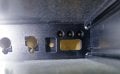 Photo inside the amp enclosure from the rear towards the front panel showing the recesses.