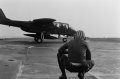 a-flight-deck-crewman-stands-by-as-an-ov-10a-bronco-aircraft-prepares-to-take-be57d6.jpg